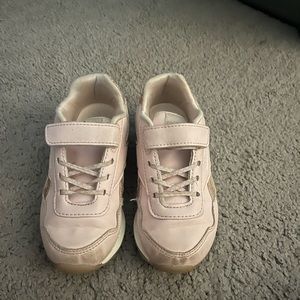 Pink Reebok sneakers.